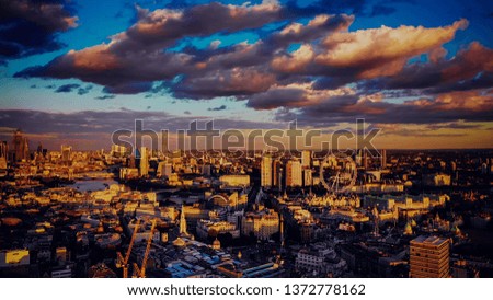 London roof top view at sunset with urban architectures and Thames River