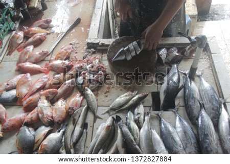 Fishmonger selling fish 