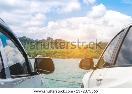 Close up two car on blue sea ocean sky seaside summer background.