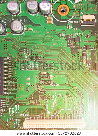 Electronic PCB printed circuit board in macro close-up with transistors circuit and electric hardware elements including computer chip with copy space for computer industry designs and ideas.Close up.