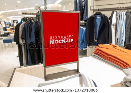 Mock up vertical blank banner or signboard with clipping path to show promotion or discount in shop clothing, Red screen empty space for insert text or advertising in shopping mall