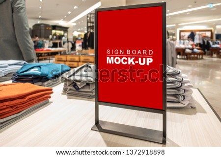 Mock up vertical blank banner or signboard with clipping path to show promotion or discount in shop clothing, Red screen empty space for insert text or advertising in shopping mall
