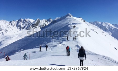 Tourists on snow covered rigde, Kasprowy Wierch,  Poland