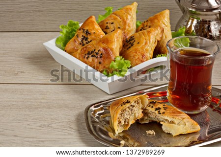suitable for the Nauryz or Navruz holidays, as well as during the Holy month of Ramazan and the holidays of Uraz A . Small Pies With Meat Samsa - Oriental Cuisine. Copy space.