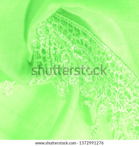 Texture, background, pattern, postcard, silk fabric, female spring green scarf with lace wrappers. Use these fancy images to create your print and digital materials.