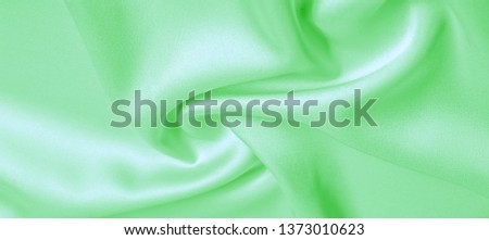 background texture, pattern. Green emerald silk fabric. This will add complexity to your design style. Its structural style characteristics are great for some of your decisions, wallpapers, posters.