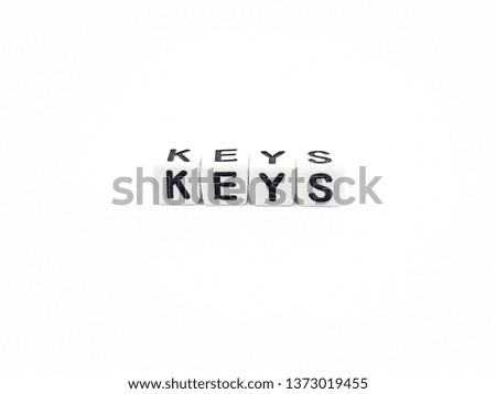 keys word built with white cubes and black letters on white background