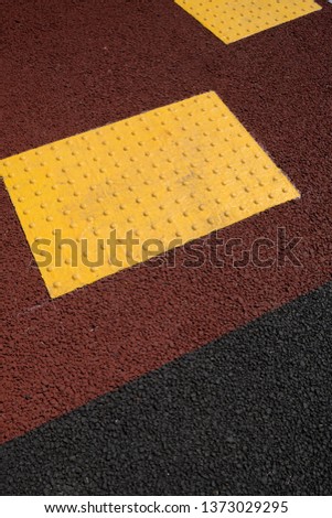 Colored tactile tiles