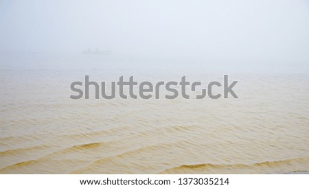 Thick fog over the water.