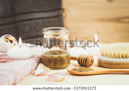 Selective focus on sauna honey scrub. Scrubbing honey and coffee mixture on body in hot sauna helps open the pores and renew, rejuvenate the skin on body. Sauna treatment concept.