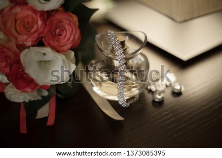 women's shoes, perfumes, invitation cards, wedding rings on an isolated background for the bride.