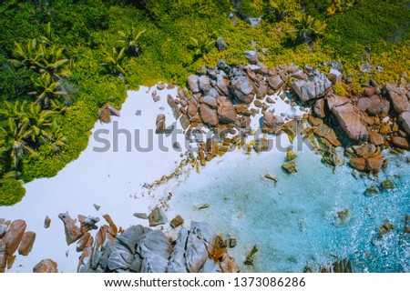 Anse Marron beach, Seychelles - tropical hidden secret beach.White sand beach with pure transparent turquoise ocean water and granite rocks - aerial drone photo Royalty-Free Stock Photo #1373086286