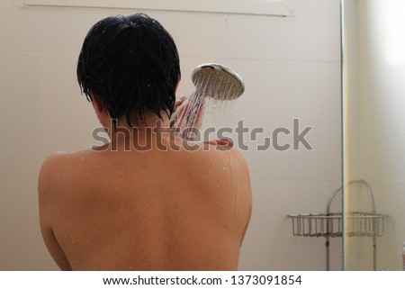 a man is taking a shower background