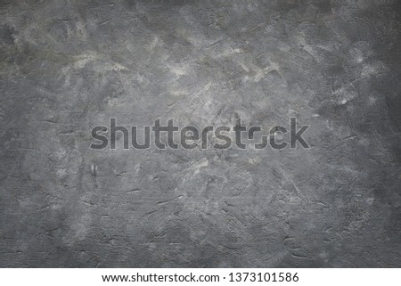  Dark grey textured background. High resolution image with copy space. Top view