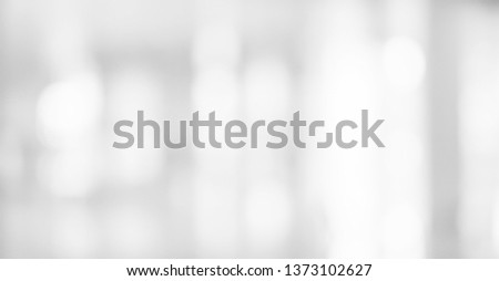 abstract blurred of gray silver background of modern contemporary interior office with bokeh light for presentation show design concept