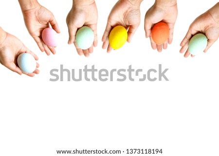 Perfect colorful handmade Easter eggs in human hand isolated on a white background. Easter day concepts. Funny decoration. Happy Easter.