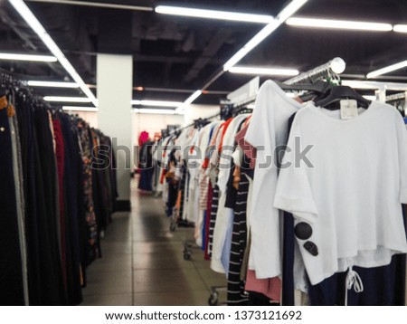 Abstract blurred photo of clothing store in a shopping mall, shopping concept.