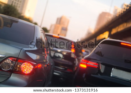 transportation vehicle and traffic concept - Blurred traffic jam and brake light in bangkok, thailand on evening