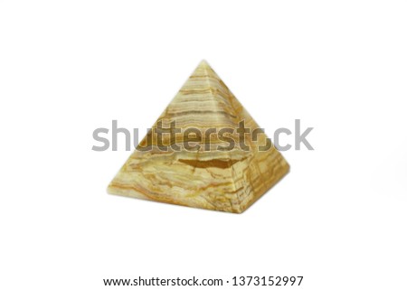 Pyramid of onyx stone with a beautiful texture isolated on white background. The pyramid architectural structure is a symbol of eternal spiritual energy made of natural stone. Souvenir polished onyx.