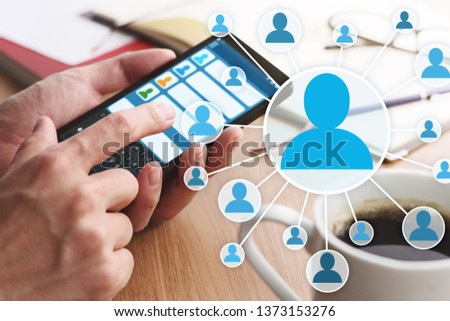Concept image of online people network and communication. 
Closeup of male hands touching smartphone screen for sending message.
