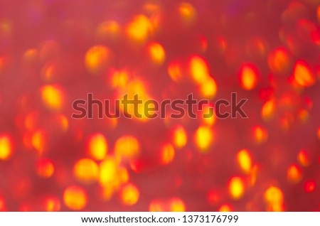 Christmas Atmosphere. Abstract Yellow-Red Background With Bokeh Effect