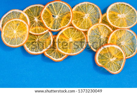 blue fruit background organic homemade orange chips