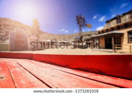 Table background of free space for your decoration and summer background. Wild west city. 