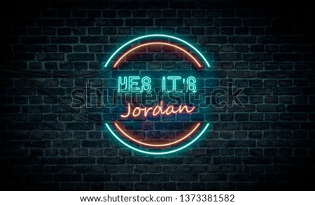A red and blue neon light sign that reads:
Yes It's Jordan