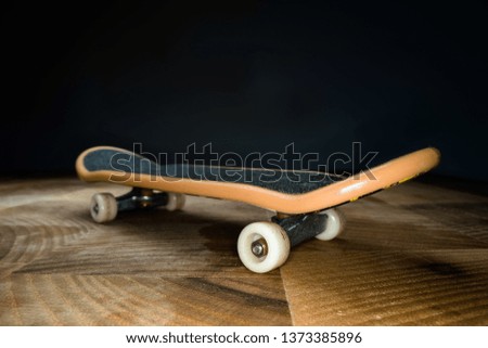 Fingerboard. A small skateboard for kids and teenagers to play with hand fingers. Youth culture, extreme sport