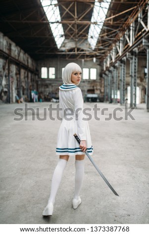 Anime style blonde woman with sword, back view