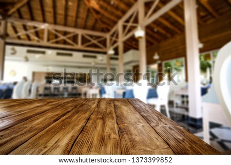 Wooden table background of free space for your decoration and restaurant interior. Summer time. 