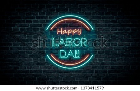 A red and blue neon light sign that reads:
Happy Labor Day