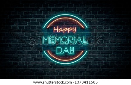 A red and blue neon light sign that reads:
Happy Memorial Day
