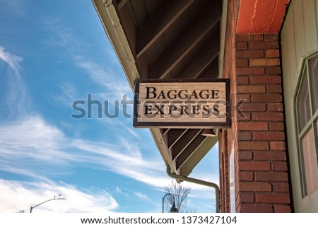 Painted sign that reads Baggage Express