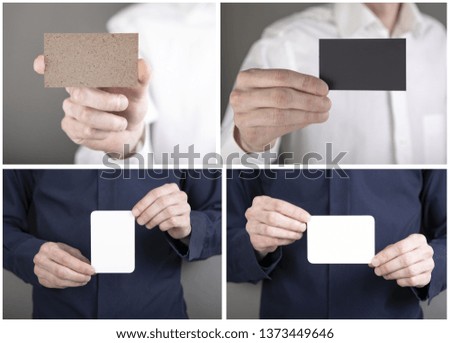 A man holding a white and black business card