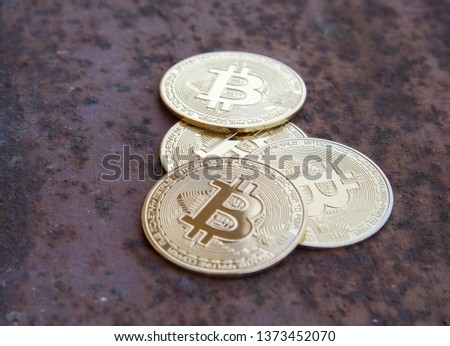 Several bitcoin Coins on rusty iron - image
