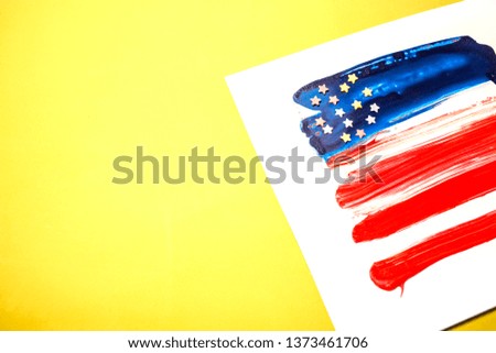 American flag over sunny yellow background