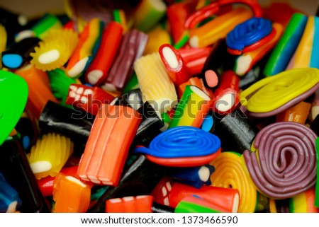 Sweet multi-colored candies on display Royalty-Free Stock Photo #1373466590