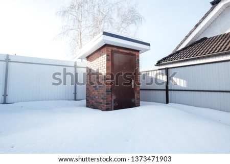 outdoor toilet in winter