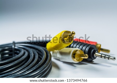 On white background hank of black cables with multi-colored plugs  tulip. Technologies. A multimedia wire for TV