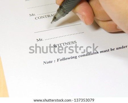 Close up of businessman signing a contract