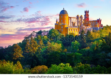 National Palace of Pena in Sintra, near Lisbon, Portugal. Picturesque landscape with dawn and green trees. Blue morning sky with clouds. Royalty-Free Stock Photo #1373540159