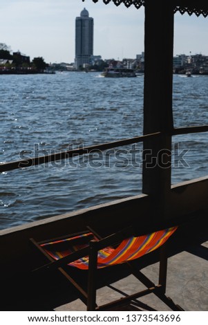 Chair overlooking the Chao Phraya River
