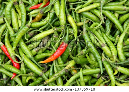 Organic peppers in a pile, bio market concept, food background
