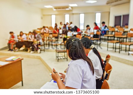 Education concept image of students in teaching and learning activity in the classroom, lecture hall, or at the learning center - academic background of learners in the university training room