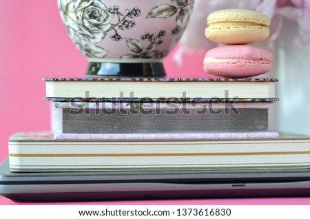 Elegant styled feminine desktop - relaxation, reading, creative writing, learning and journaling concept - with pink peonies, fruit tea and stylish stationery