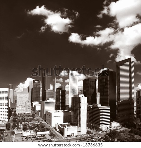 Majestic downtown Houston Texas skyline with wide open sky and clouds - Black and White
