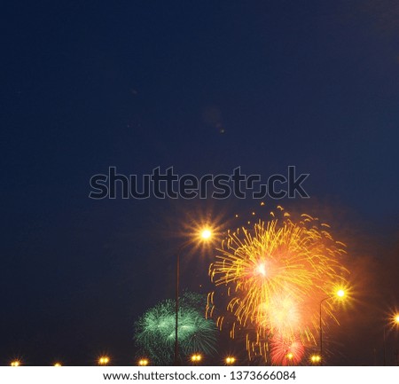 Colorful flashes of fireworks in the night sky. Fireworks. Holiday.