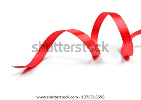 Red ribbon isolated rolled and wave on white background view.