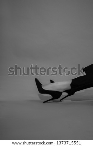 White and black photo and women’s legs